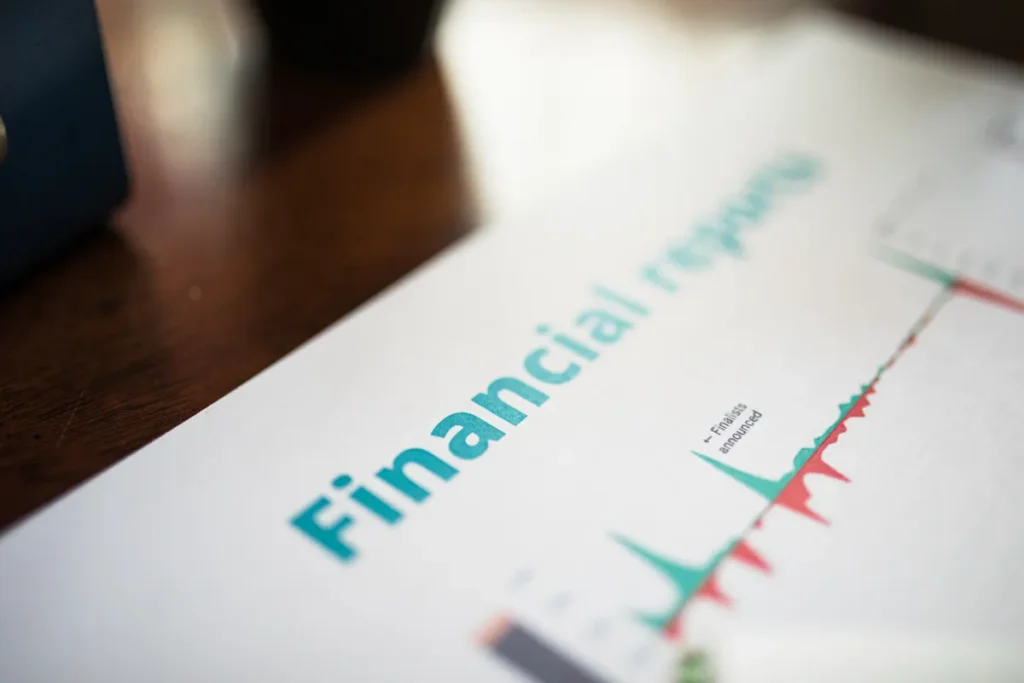 Barclays investment bank set for Q3 spotlight as Venkat targets RoTE goals Detailed view of a financial report with a focus on graphs and data analysis